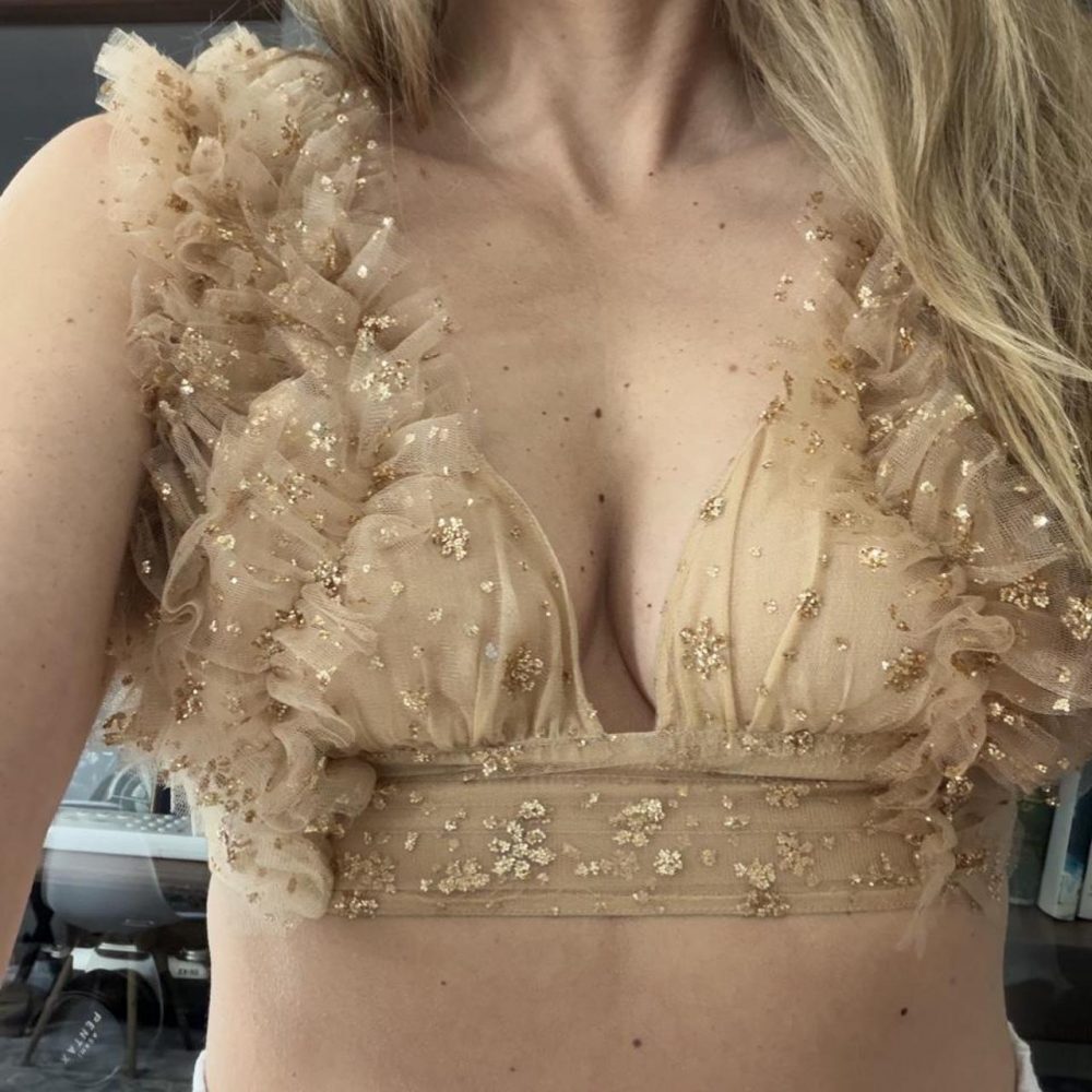 Free people sosha party top sized medium but fits closer to size 4/6.